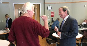 Register of Deeds Bill O'Donnell speaks with a senior citizen after his lecture at the Center at the Heights.