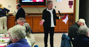 Town Clerk Carol Marple talks to the senior citizens about voting information at the weekly luncheon at the Pilgrim Church.