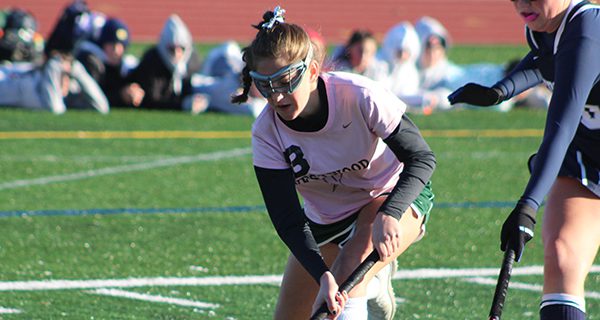 Julia Hess (8) fights off a defender and cuts to the cage late in the first half. Photos by Michael Flanagan