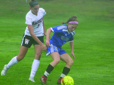 DS’s Mica Bodkins (2) attempts to navigate around Wellesley’s Brooke Baker (1) late in the first half.