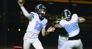 Medfield quarterback Stephen Williams (13) steps up in the pocket and fires a dime early in the first quarter.