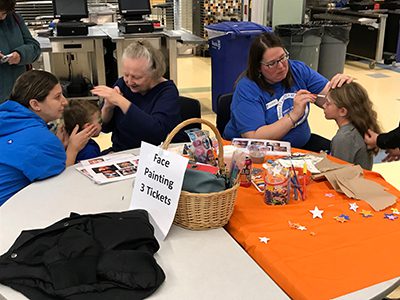 Kids have their faced painted at the annual Rotary pancake breakfast at Needham High School. Photos by Robby McKittrick