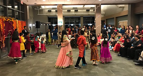 Kids walk around in a circle with candles, marking the beginning of Diwali at Westwood High School. Photos by Robby McKittrick