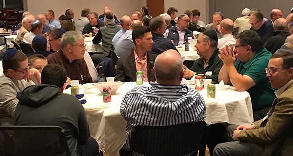 Former Boston Red Sox reliever Craig Breslow enjoys a repast with members of the community during Temple Aliyah’s annual Men’s Club event.