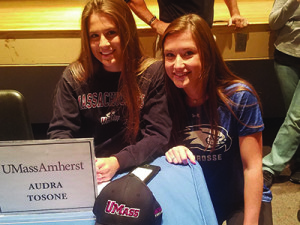 Audra Tosone (left) and Abby McLaughlin (right) will play together this spring on the lacrosse field before going head-to-head throughout the next four years at UMass and UMass Lowell. Photos by Twitter, @WalpoleAD