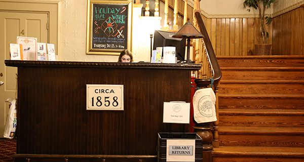 Check in for Community Center events on the left, return your books to the right. Photos by Alex Oliveira