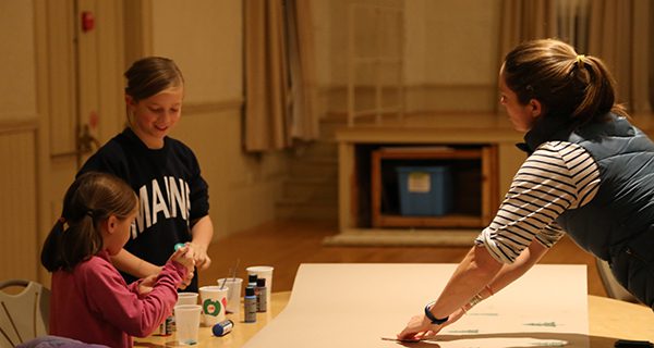 New digs, but the fun goes on: the library’s holiday wrap-a-thon this past Wednesday. Photos by Alex Oliveira