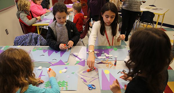 With ‘America The Beautiful’ playing in the background, kids rendered scenes from the song out of construction paper. Photos by Alex Oliveira