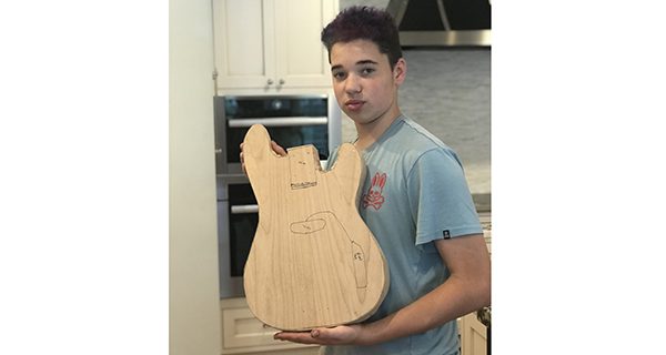 Step one in the process, Aiden cut this telecaster bass from a piece of alder with a hand saw. Photos by Alex Oliveira