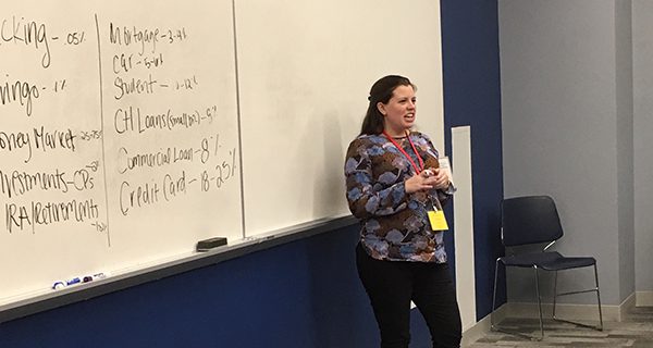 Needham Bank’s Marketing Event & Community Relations Manager Erica Shom teaches ‘How to Manage your Money’ to NHS seniors.