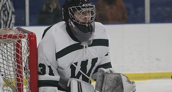 Junior goalie Ben Goodrich (pictured) keeps an eye on the play and hugs the post. Photos by Michael Flanagan