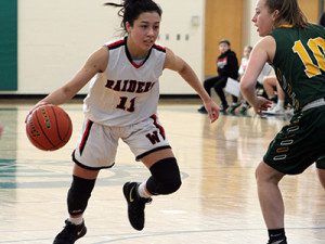 Senior captain Gianna Palli (11) drives the ball to the rim before converting two of her game-high 25 points on Sunday afternoon against King Phillip. Photos by Michael Flanagan