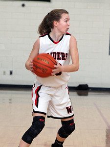 Senior captain Molly Cronin (pictured) scouts the scene and gets ready to make a cut to the basket. Photos by Michael Flanagan