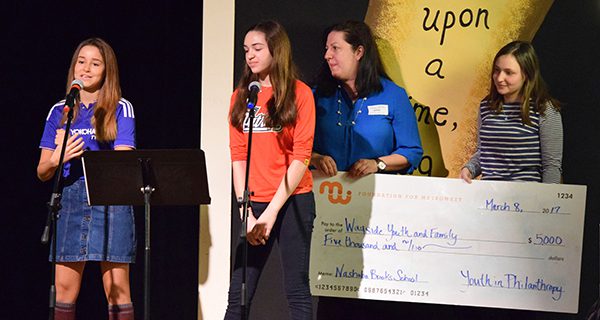 The Nashoba Brooks School YIP students speaking about what philanthropy means to them before presenting $5,000 to Wayside Youth and Family.