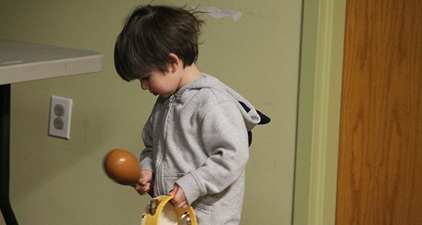 A young man selects his instrument of choice.