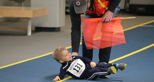 A young competitor needs a helping hand after a dramatic fall.