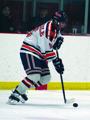 Senior captain Conor Foley (pictured) holds a bouncing puck in at the point while the power play. Photos by Michael Flanagan