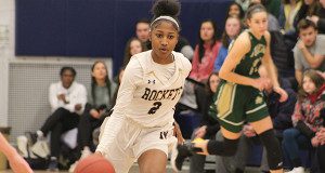 Sophomore guard Kiki McIntyre (2) moves the ball up the floor before converting two of her game-high 20 points on Friday night against Bishop Feehan.