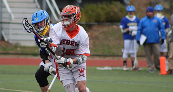 Sophomore fogo Ben Quinn (15) wins one of his 14 face-offs against Lexington during Thursday afternoon’s 10-5 victory in the Coaches Cross Cup semifinals.