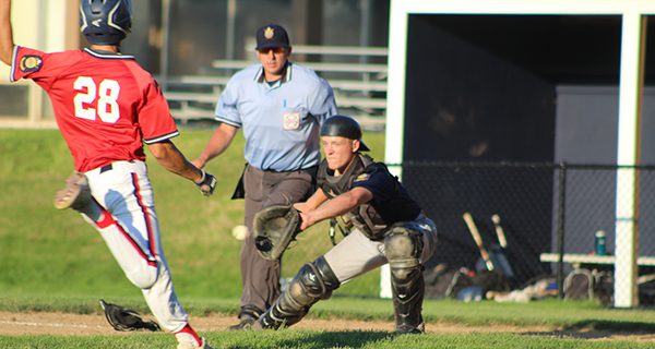 Drew Dorsey (pictured) gathers in a throw from centerfield and gets set to supply the tag to Walpole’s Will Jarvis (28) for the inning-ending out in the bottom of the fifth. Photos by Mike Flanagan