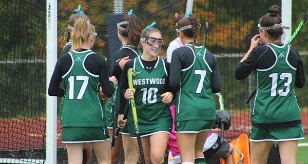 Elizabeth Watson (10) celebrates with teammates following her goal early in the first half of Thursday’s 5-1 win at Medfield. Photos by Mike Flanagan