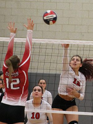 Veronika Caruso sends one over the net during a tight first set. Photos by James Kinneen