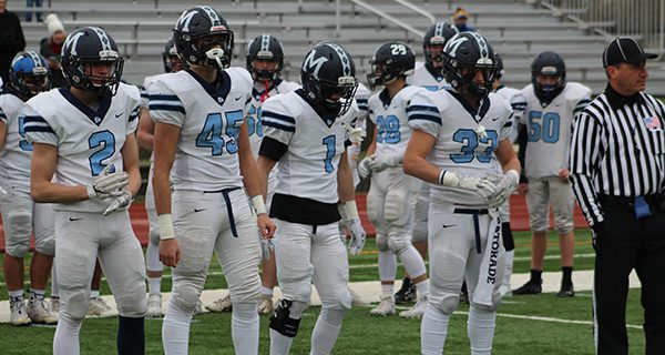 From left-to-right, senior captains Jimmy Cosolito (2), Luke Slavik (45), Sam Joline (1) and Cam Giunta (33) get set for the pregame coin toss.