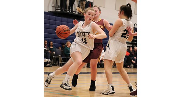 Erin Walker makes an aggressive drive to help the Rockets secure a 60-31 victory over Weymouth. Photos by Twisty Dorion.