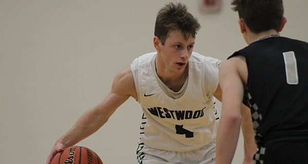 Senior captain Jack Terzian (4) dribbles around a defender midway through the third quarter. Photos by Mike Flanagan