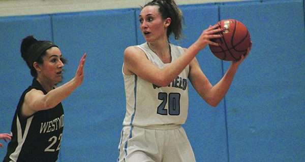 Junior captain Camilla Silk (20) backs down her defender and drives the ball to the rim. Photos by Mike Flanagan