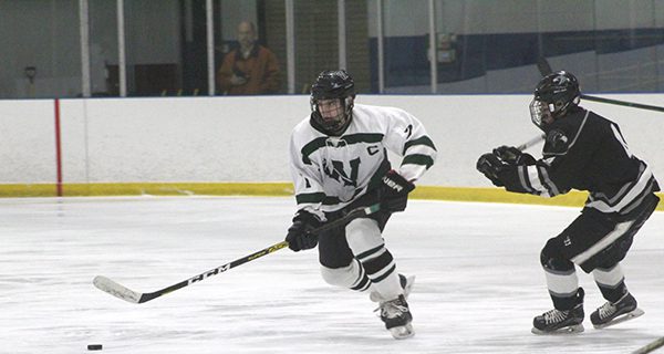 Junior captain and forward Colin Fahey (7) moves the puck through the neutral zone. Photos by Mike Flanagan